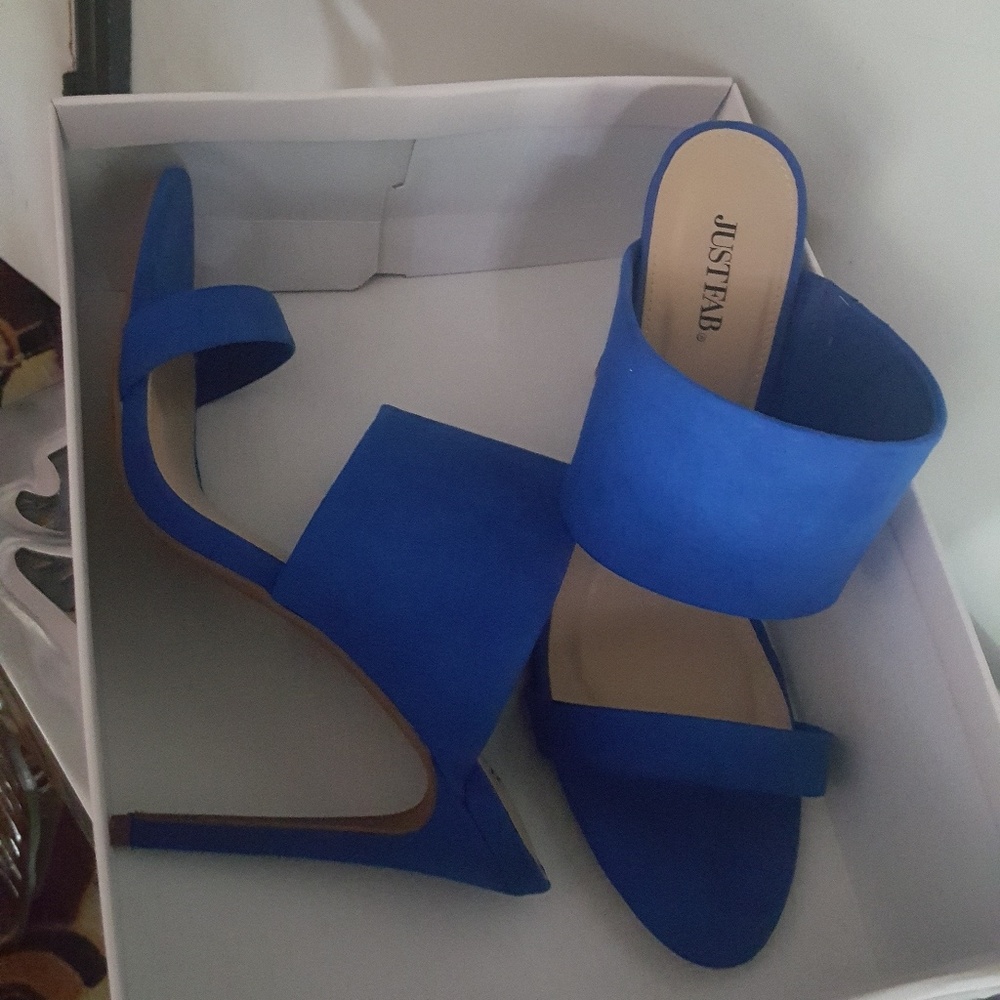 A pair of dress heeled sandals